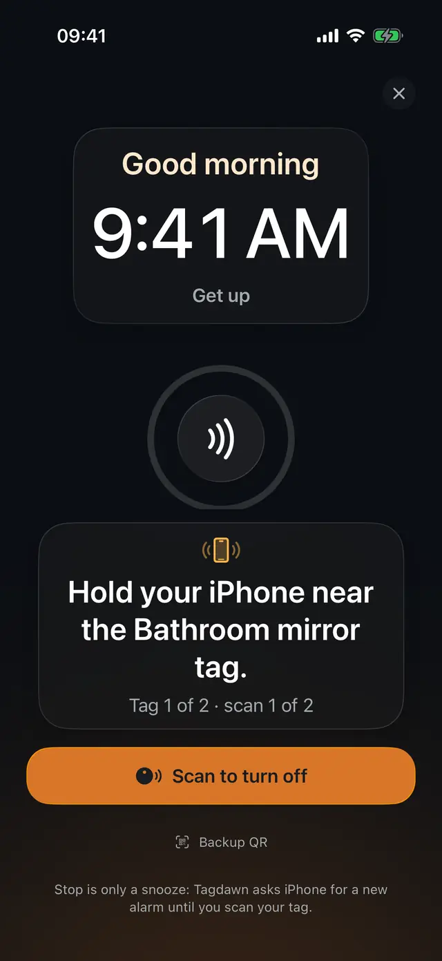 Tagdawn ringing screen with a large clock, an NFC scan beacon, the Bathroom mirror tag instruction, a Scan to turn off button, and a three-minute ring-again note.